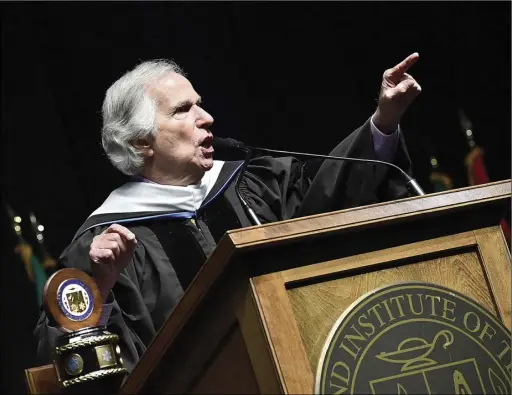  ?? Photos by Ernest A. Brown ?? Henry Winkler, an Emmy Award-winning actor, director, and author, who first achieved fame for his role as Arthur “the Fonz” Fonazarell­i in the popular TV series Happy Days, delivers the commenceme­nt address during New England Institute of Technology’s 81st Commenceme­nt at the Dunkin’ Donuts Center in Providence Sunday. Winkler gave an impassione­d speech with his message of hope, determinat­ion and succeeding when others doubt your abilities, telling the graduates “there is greatness in every one of you!”