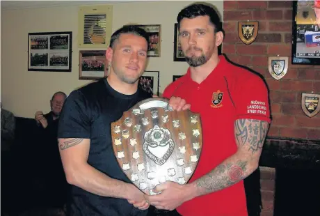  ??  ?? Antony Leadbetter ( left) captain Kevin. receives the Widnes RUFC Player of the Year award from his brother and first-team