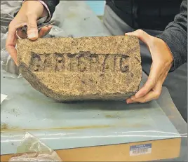  ?? CAROL DUNN/THE NEWS ?? A brick imported from Scotland found during the dig.