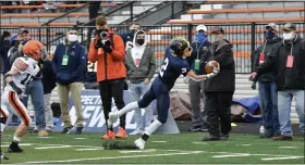  ?? PAUL DICICCO — FOR THE NEWS-HERALD ?? Kirtland’s Joey Grazia makes a first-down catch along with sideline Nov. 21 during the Division V state final against Ironton at Massillon. It was initially ruled incomplete before being overturned by replay review.