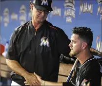  ?? LYNNE SLADKY / AP ?? Marlins manager Don Mattingly consoles starting pitcher Justin Nicolino after he was removed in the fourth inning. Nicolino has pitched past the fourth just once in five starts.