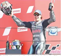  ??  ?? Morbidelli celebrates on the podium after winning the San Marino MotoGP Grand Prix at the Misano World Circuit Marco Simoncelli. - AFP photo