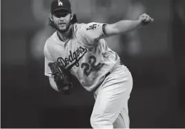  ?? DAVID ZALUBOWSKI/AP ?? Clayton Kershaw, seen during a 2017 game against the Rockies, agreed last week to a two-year deal with the Dodgers.