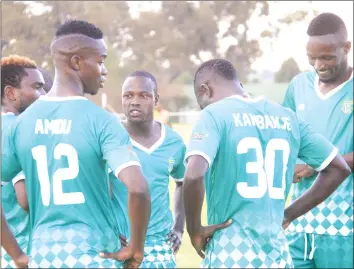  ?? by Munyaradzi Chamalimba — Pictures ?? ECSTASY AND GLOOM . . . Yadah Stars players, led by skipper Jimmy Dzingai, celebrate the captain’s opening goal, while CAPS United players go through a painful soul-searching exercise at Morris Depot yesterday.