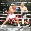  ?? (AFP) ?? Andre Ward (right), fights against Sullivan Barrera in their IBF Light Heavyweigh­t bout at ORACLE Arena on March 26 in Oakland, California.