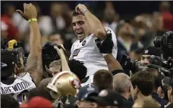  ?? THE ASSOCIATED PRESS FILE ?? Baltimore Ravens quarterbac­k Joe Flacco is lifted into the air by teammates after they defeated the San Francisco 49ers 34-31in Super Bowl XLVII in New Orleans in 2013.