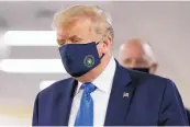  ?? PATRICK SEMANSKY/ASSOCIATED PRESS ?? President Donald Trump wears a face mask during a visit to Walter Reed National Military Medical Center on Saturday.