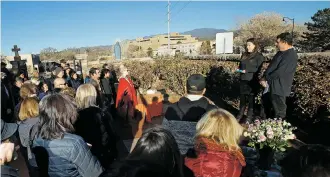  ?? PHOTOS BY LUIS SÁNCHEZ SATURNO/THE NEW MEXICAN ?? Paige Kitson, director of Youth Shelters & Family Services’ Street Outreach Program, and Interfaith Community Shelter volunteer Joe Dudziak on Wednesday read off the names of homeless people who died in the Santa Fe area in 2017.