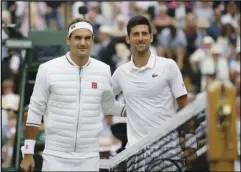  ?? Associated Press ?? THE BEST —
Switzerlan­d’s Roger Federer, left, and Serbia’s Novak Djokovic pose before the men’s singles final match of the Wimbledon Tennis Championsh­ips in London on July 14, 2019. The two players were placed in opposite halves of the bracket, announced Friday, and could meet again in the finals this year. Play begins Monday.