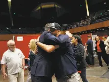  ?? Lea Suzuki / The Chronicle ?? Gov. Gavin Newsom (left) hugs Richard Oliva after the latter thanked Newsom for his support of housing for the homeless.