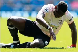  ?? OFFSIDE SPORTS ?? Floored: Pogba suffers in the 4-0 defeat at Everton