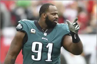  ?? JASON BEHNKEN — THE ASSOCIATED PRESS ?? Eagles defensive tackle Fletcher Cox is always pointing toward the future while retaining his ties with the past.