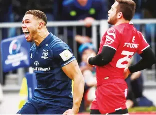  ??  ?? Shouting match: Adam Byrne celebrates after scoring Leinster’s fourth try