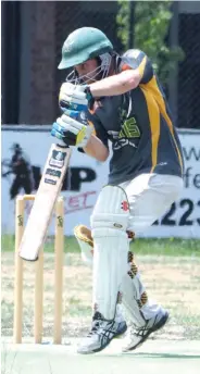  ??  ?? Garfield-Tynong batsman Matt Maxwell is deceived by pace and hits the ball in the air defence.