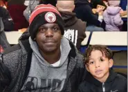  ?? JESI YOST — FOR MEDIANEWS GROUP ?? Melvin Ross and Kayden Ross, 6, attend Hereford Elementary’s WATCH D.O.G.S. kickoff party. “This is the first time they did something with the dads. So, I wanted to come out and show my support.”