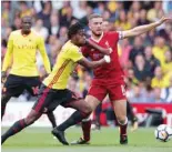  ?? — Reuters ?? Watford’s Nathaniel Chalobah in action with Liverpool’s Jordan Henderson.