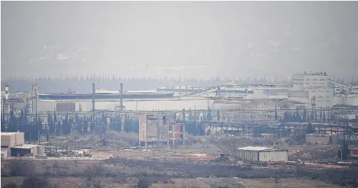  ?? PHOTOS: REUTERS ?? The Aluminij Mostar aluminium factory in Mostar, Bosnia, which closed its doors in July after it could not pay its electricit­y bills.
