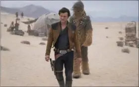  ?? JONATHAN OLLEY/LUCASFILM VIA AP ?? This image released by Lucasfilm shows Alden Ehrenreich and Joonas Suotamo in a scene from “Solo: A Star Wars Story.”