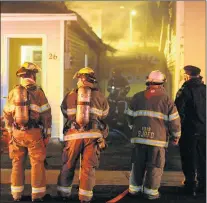  ??  ?? Firefighte­rs at an early Monday morning house fire on Cashin Avenue in St. John’s.