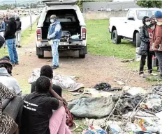  ?? Picture: LUVUYO MJEKULA ?? SERVICE ISSUES: Upset residents of a Komani location gather at the scene where Asanda Mata collapsed and died while on his way back from seeking medical help at a local clinic on Friday