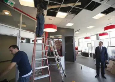  ?? CHRIS SO PHOTOS/TORONTO STAR ?? Charles Lambert, CEO of Wealth One Canada, visits Markham as work continues on the company’s only retail branch in Canada. Wealth One plans to cater to Chinese Canadians and will provide services in Cantonese and Mandarin.