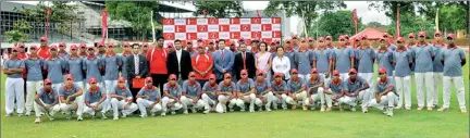  ??  ?? The young cricketers who will be undergoing training in the four camps of the Coca-Cola Cricket Pathway pose for a picture with the officials.