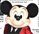  ??  ?? An actor in a Mickey Mouse costume. — File photo