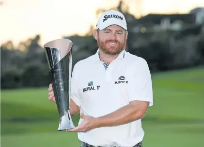  ?? Picture: AFP ?? A LONG TIME COMING. American JB Holmes with the trophy after winning the Genesis Open at the Riviera Country Club in Pacific Palisades on Sunday.