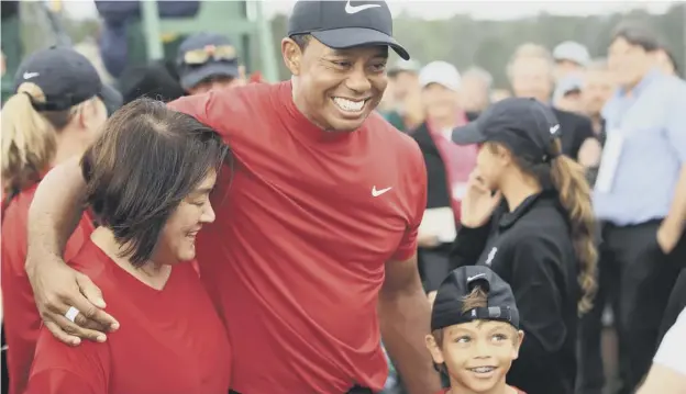  ??  ?? 0 Tiger Woods celebrates his Masters win last year with son Charlie. The pair will play together at the PNC Championsh­ip in Orlando next month.