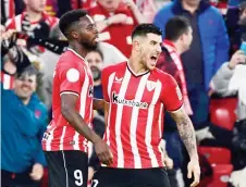  ?? Photo AFP ?? Athletic Bilbao’s Inaki Williams (left) celebrates with Yuri Berchiche. —