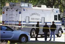  ?? Ned Gerard / Hearst Connecticu­t Media ?? Connecticu­t state police at the scene of a shooting in Bridgeport last year.