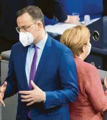  ?? Foto: dpa ?? Wie ist ihr politische­s Verhältnis? Gesundheit­sminister Jens Spahn muss sich nicht nur für Fehler in der Pandemie‰Bekämpfung rechtferti­gen, sondern auch einen Entzug von Kompetenze­n durch Kanzlerin Angela Merkel hinnehmen.