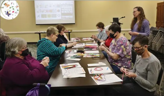  ?? PHOTOS BY ALIAH KIMBRO — THE MORNING JOURNAL ?? Lorain Public Library patrons enjoy a Crafternoo­n on March 15.