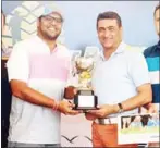  ?? PHOTO SUPPLIED ?? Cousins Khusaal Thackersey and Amish Jaitha pose with the trophy after winning last year’s Angkor Four-Ball Championsh­ip.