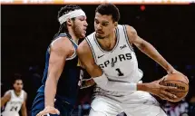  ?? Sam Owens/Staff photograph­er ?? Victor Wembanyama, right, said he understand­s the Spurs’ front office faces a “tricky” task in building a winning team.