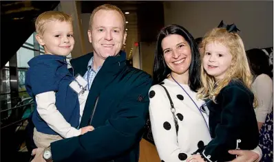  ??  ?? Scott and Amy Curran of Chicago with their children Ray and Asprey