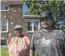  ??  ?? Beatriz Zarate and her son, Chris Alonso, outside their Harvey home Thursday.