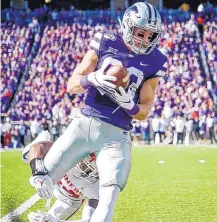  ?? IAN MAULE/ASSOCIATED PRESS ?? Kansas State wide receiver Dalton Schoen hauls in a pass ahead of Oklahoma defensive back Brendan Radley-Hiles.