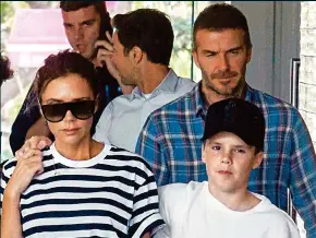  ??  ?? Distressed: Victoria and David Beckham with son Cruz in Australia