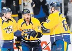  ?? USA TODAY SPORTS ?? Predators centre Mike Ribeiro, centre, celebrates with teammates.