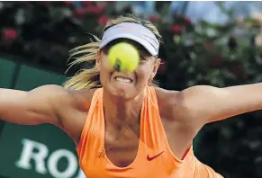  ?? — GETTY IMAGES ?? Russia’s Maria Sharapova keeps her eye on the ball during her match against Mirjana Lucic-Baroni of Croatia. Sharapova didn’t finish the match, citing an apparent left thigh injury.