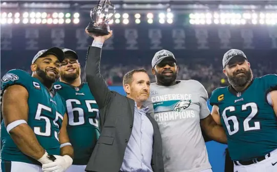  ?? MATT SLOCUM/AP ?? Eagles general manager Howie Roseman celebrates returning to the Super Bowl with players Brandon Graham, Lane Johnson, Fletcher Cox and Jason Kelce on Sunday.