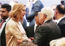  ??  ?? SHUNEH, Jordan: Israeli MP Tzipi Livni speaks with Palestinia­n President Mahmoud Abbas during the opening session of the World Economic Forum held in this Dead Sea resort yesterday. — AFP