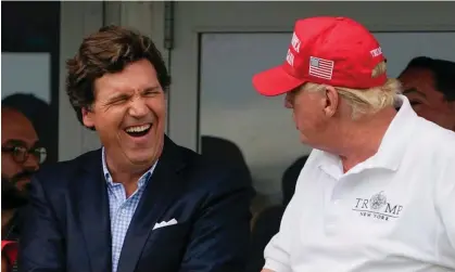 ?? Photograph: Seth Wenig/AP ?? Tucker Carlson and Donald Trump at the former president’s New Jersey golf club in July last year. A text this week showed Carlson said of Trump: ‘I hate him passionate­ly.’