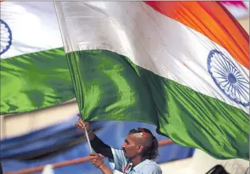  ?? Dibyangshu Sarkar
AFP/ Getty I mages ?? THE FLAG of India is waved at the World T20 cricket tournament last month. About 22,000 people have signed a petition to prevent California from changing “India” to “South Asia” in its social studies curricula.