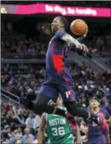  ?? PAUL SANCYA — THE ASSOCIATED PRESS ?? Pistons guard Kentavious Caldwell-Pope (5) dunks against the Celtics in the first half Sunday in Auburn Hills, Mich.