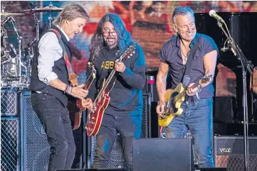  ?? ?? TICKET TO PRIDE: Sir Paul McCartney on stage with Dave Grohl and Bruce Springstee­n.