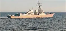  ?? Associated Press ?? In a photo from the Russian Defense Ministry Press Service, the U.S. destroyer USS Chafee is seen from the Russian navy's Admiral Tributs in the Sea of Japan on Friday.