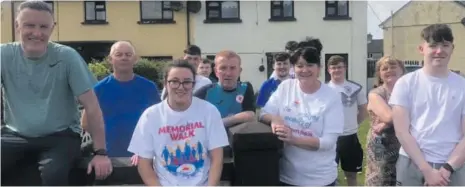  ??  ?? Residents of Maugherabo­y, who walked in memory of members of their community.