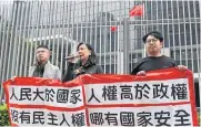  ?? AFP ?? Members of the League of Social Democrats hold up a banner during a protest in Hong Kong yesterday.